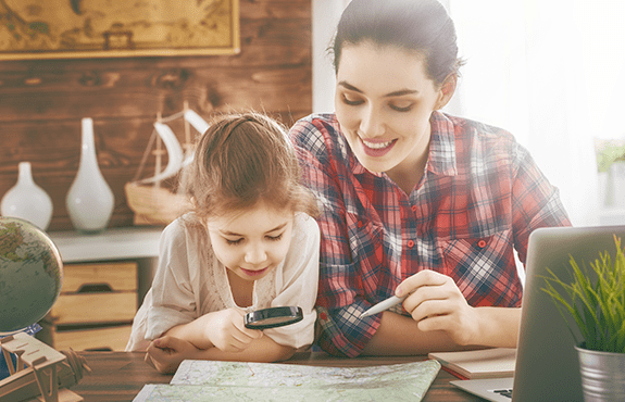 Start Planning Next Year's Trip To Bar Harbor Now mother and daughter looking at maine map